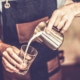 Young barista is making a coffee